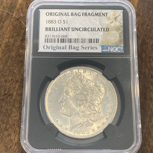 1883-O Morgan Dollar w/ Original Bag Fragment - NGC - Brilliant Uncirculated